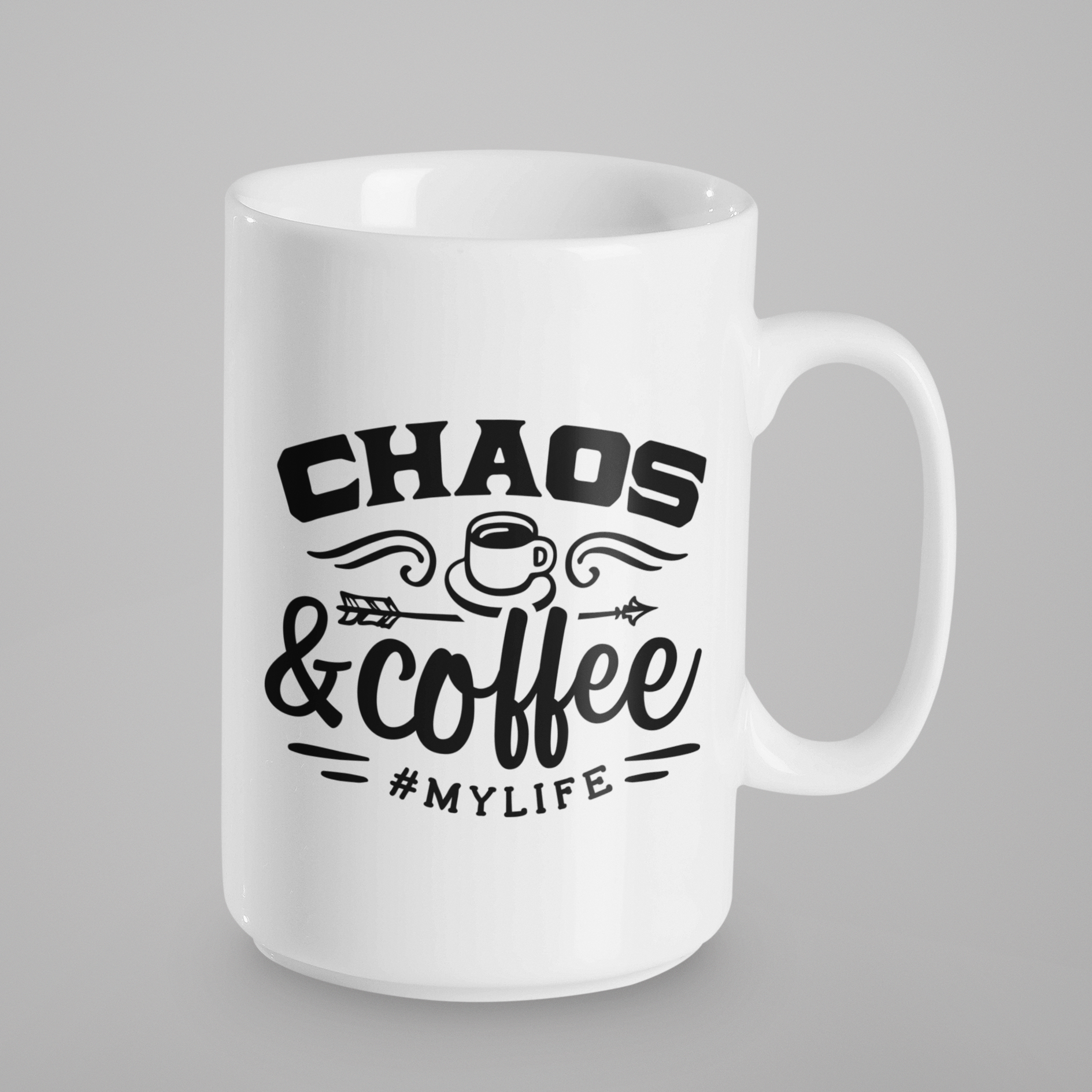 A white 15oz coffee mug with black writing that says, chaos & coffee #mylife