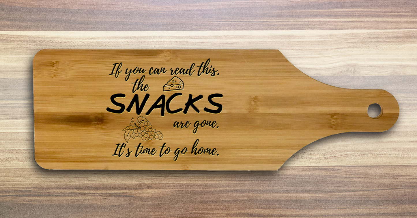 Laser engraved bamboo charcuterie board that says If you can read this the snacks are gone it's time to go