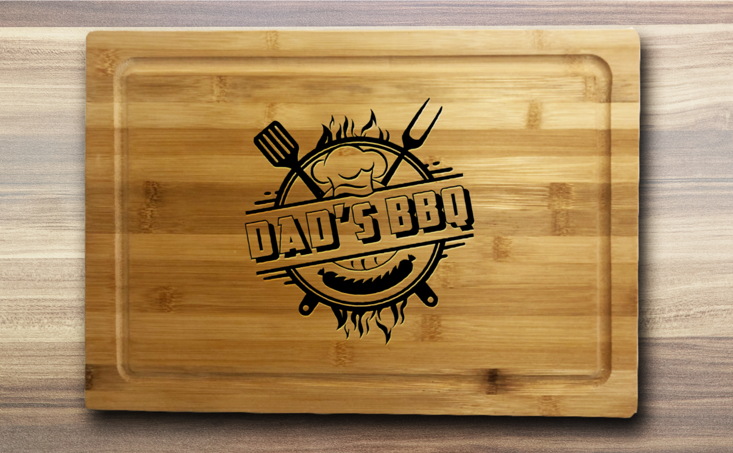 a  laser engraved bamboo cutting board with Dad's BBQ and utensils in the middle