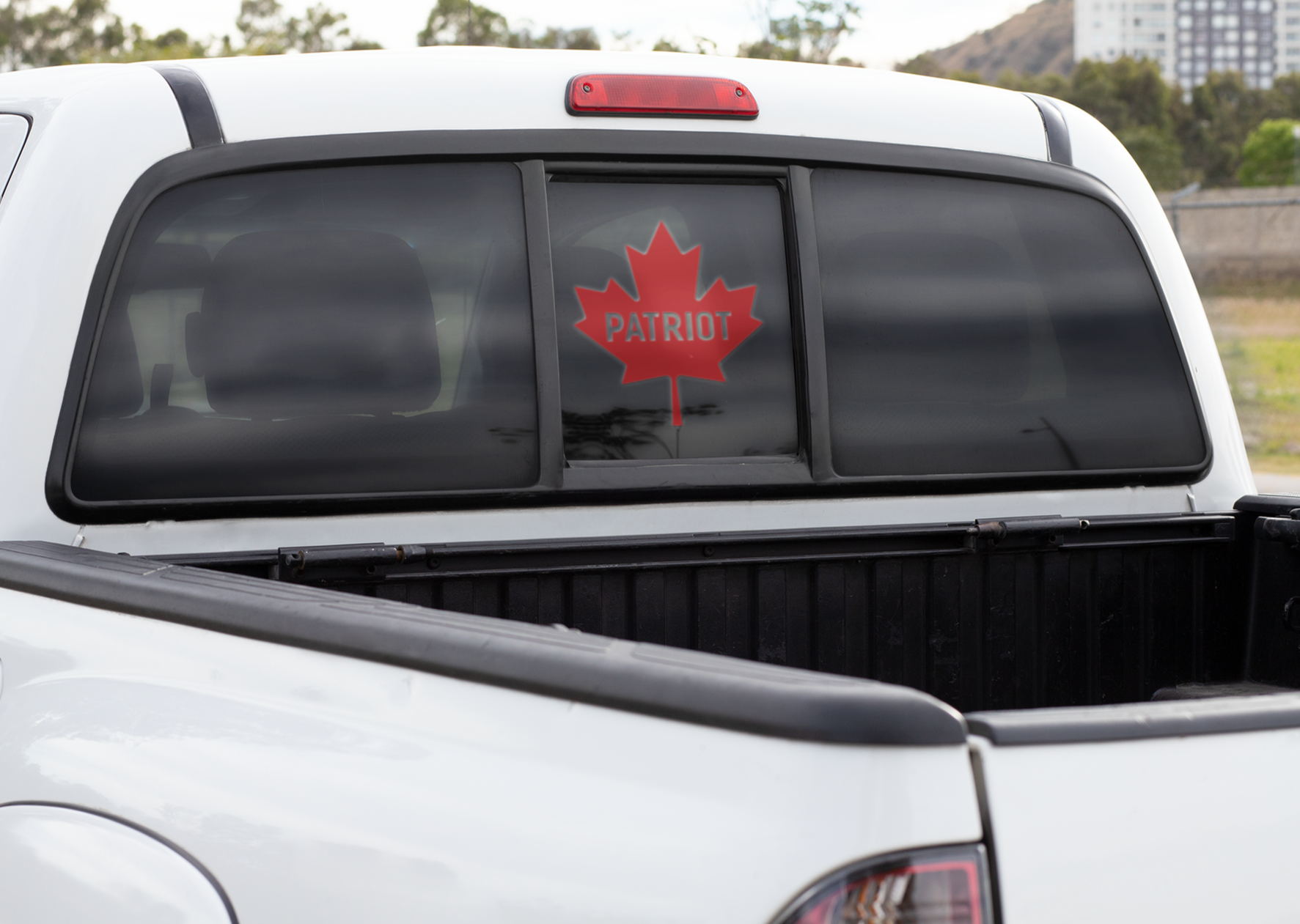 Red Canadian Patriot Window Decal on back of truck window 